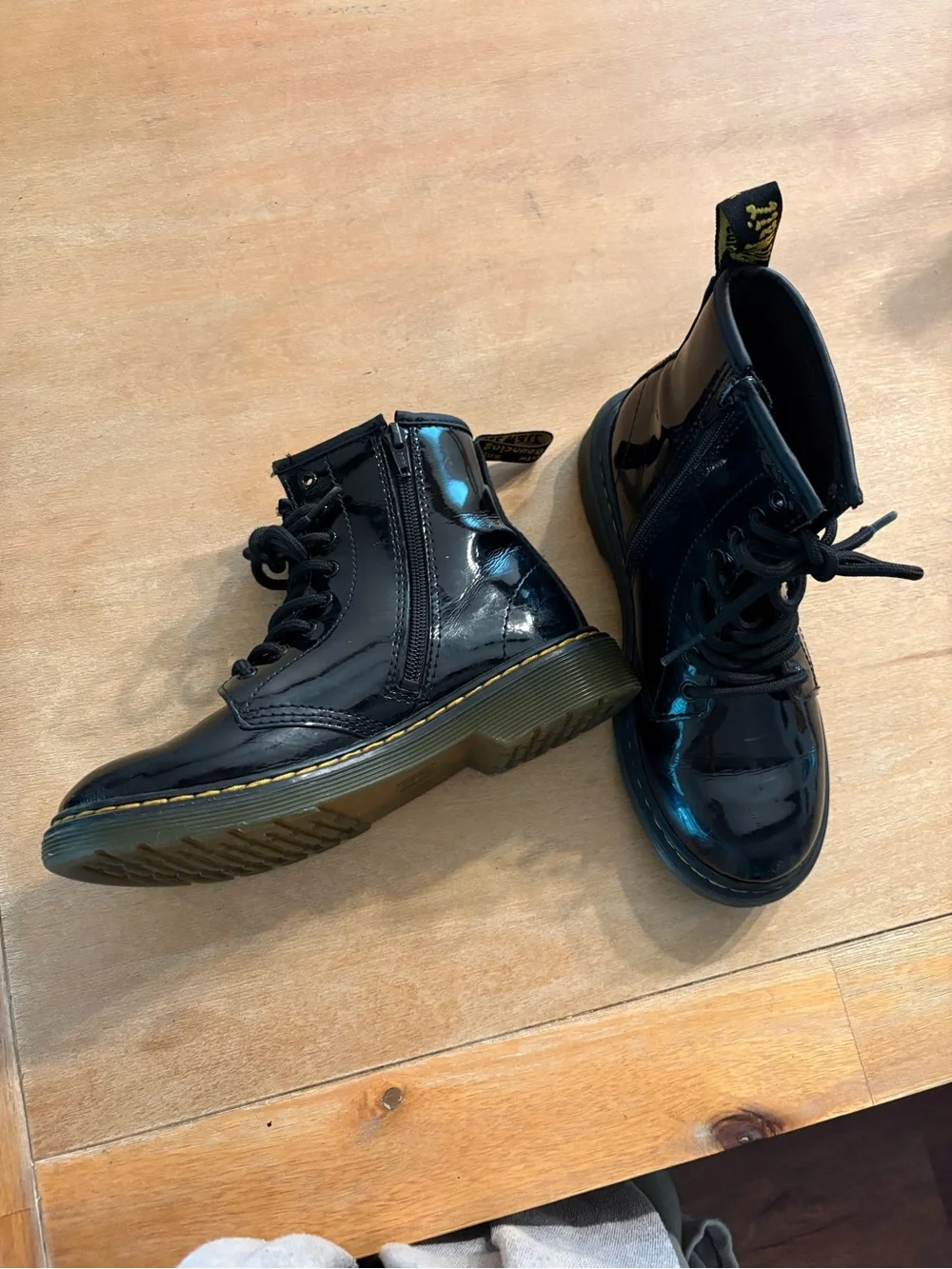 Dr. Martens Kids Black Patent Lace-Up Boots with Yellow Heel Loop